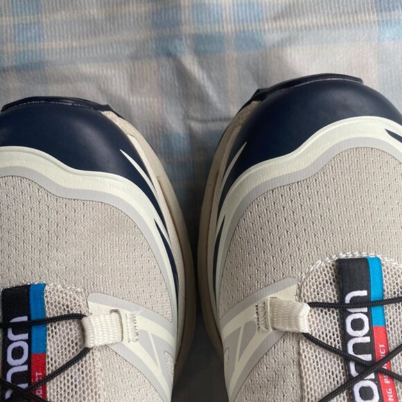 Salomon Sneakers Are Light Gray With Black Laces. - Picture 5 of 9